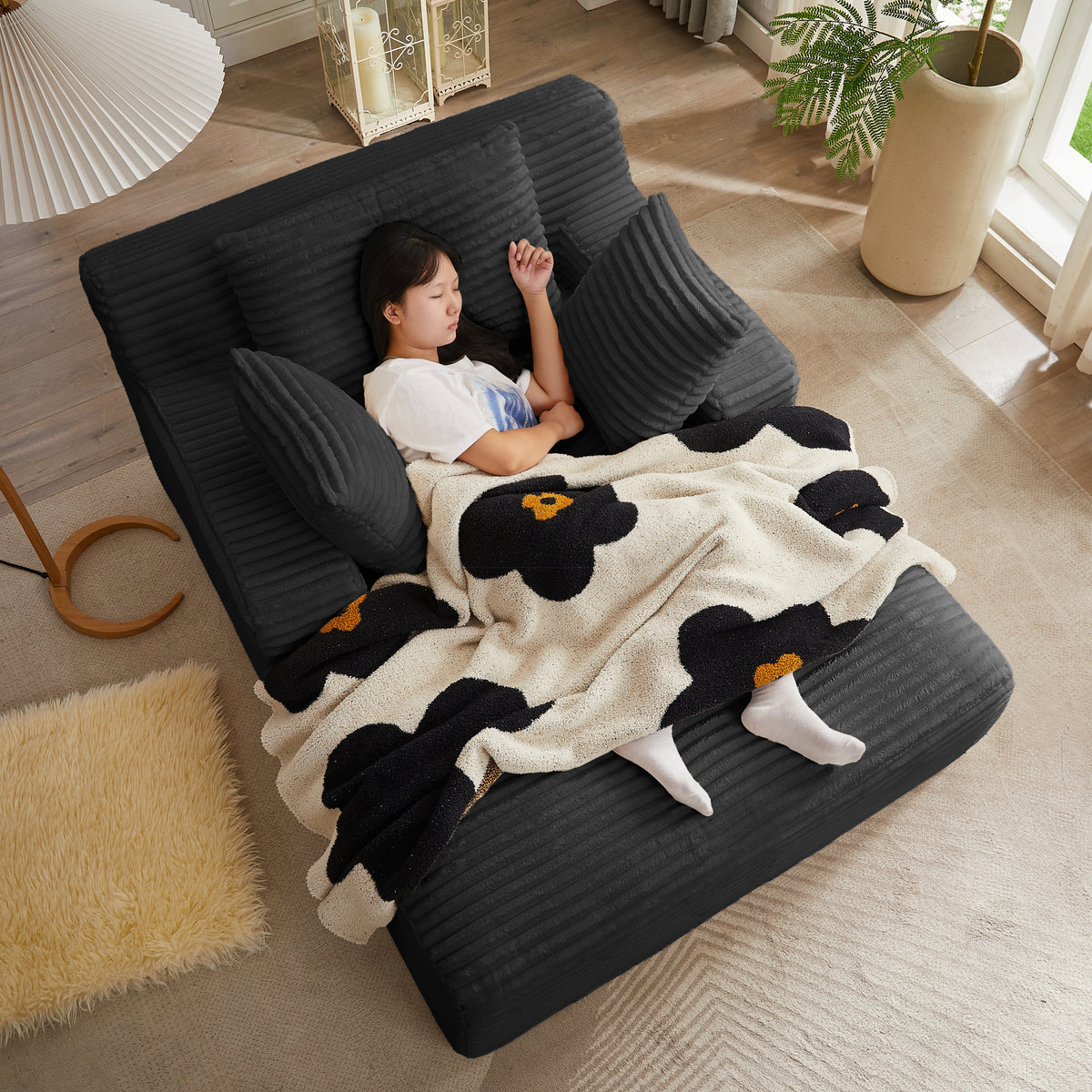 Chaise Lounge Oversized Seating Black Corduroy in a modern living room
