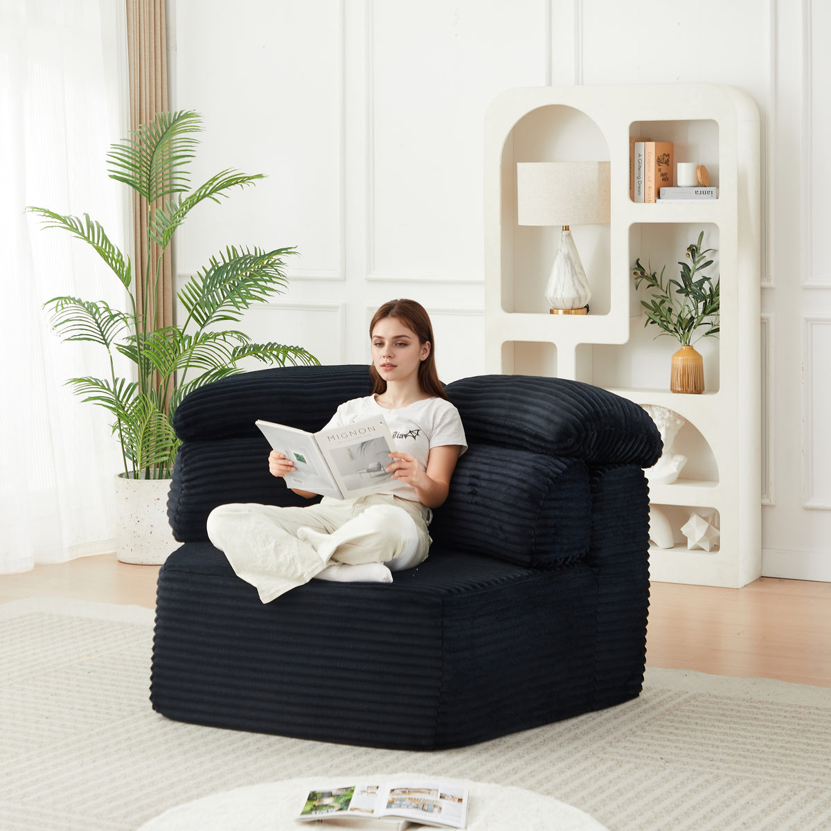 Close-up detail of Lounge Chair Modern Cushioned Seating Black Corduroy 1-Seater